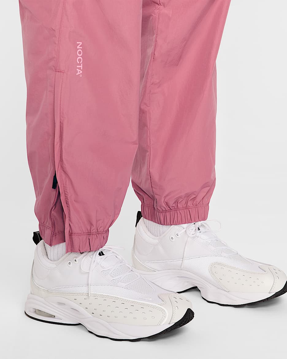 Nike Men s NOCTA Northstar Nylon Track Pants Pink